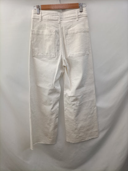 ZARA.Pantalones blancos acampanados T.36