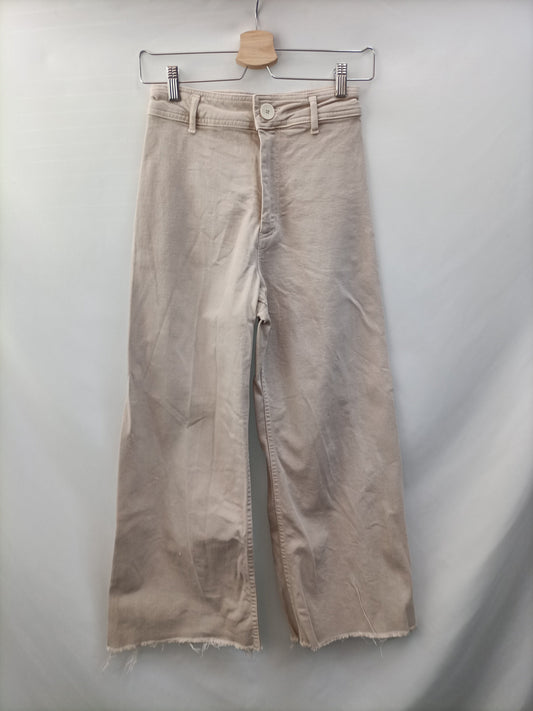 ZARA.Pantalones beiges acampanados T.36
