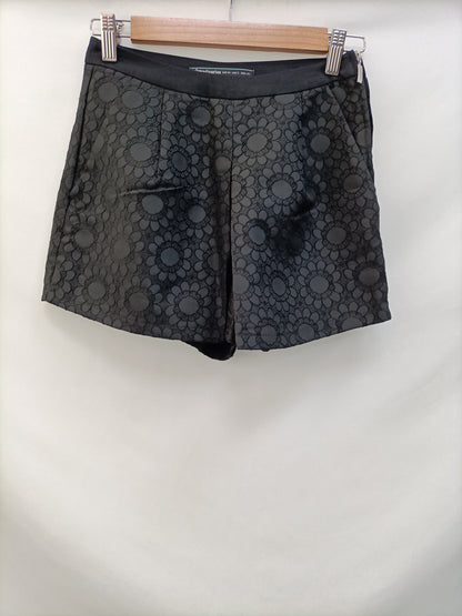 STRADIVARIUS. Pantalón textura T.34