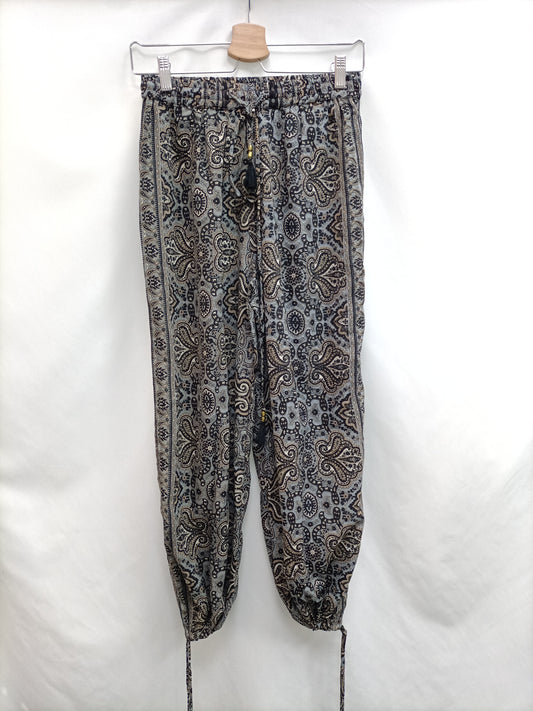 NAIF. Pantalón negros amebas T.s/m