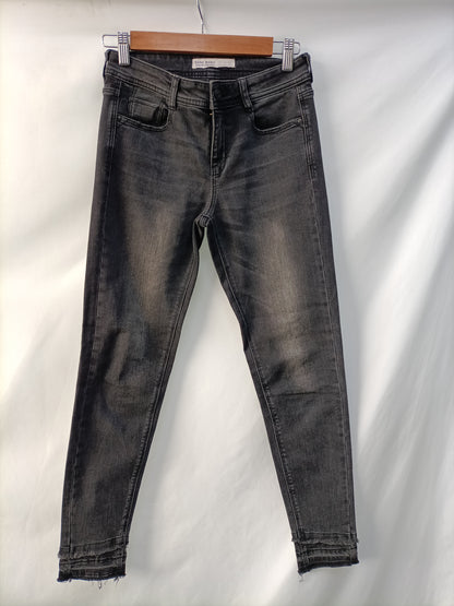 ZARA. Black distressed trousers, size 34