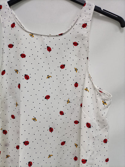 STRADIVARIUS. Top blanco lunares T.s