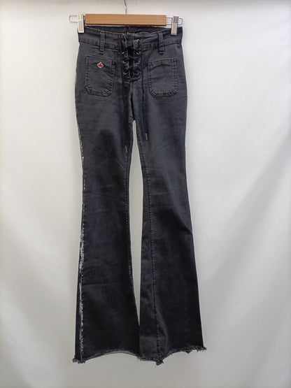 NOON. Pantalón negro campana T.32