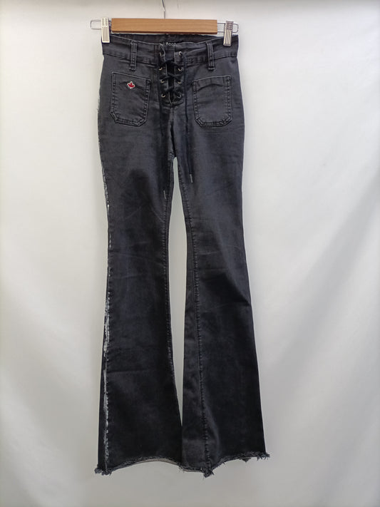 NOON. Pantalón negro campana T.32