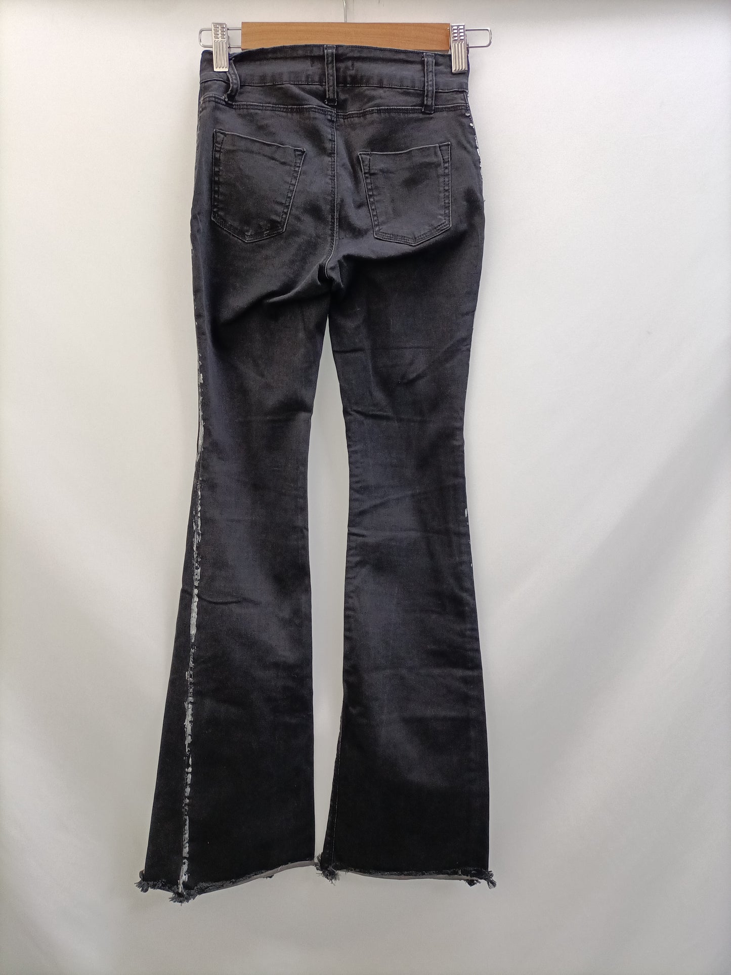 NOON. Pantalón negro campana T.32