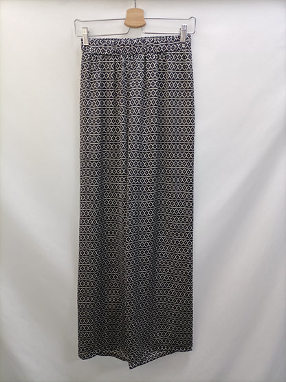 BRANDY MELVILLE. Pantalón fluido estampado T.s