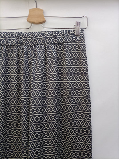 BRANDY MELVILLE. Pantalón fluido estampado T.s