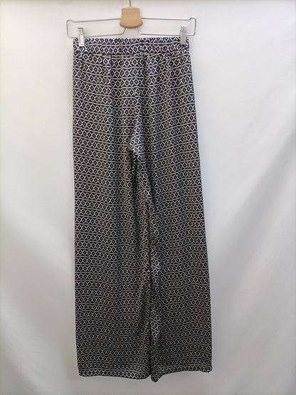 BRANDY MELVILLE. Pantalón fluido estampado T.s