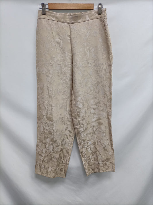 SCALPERS. Pantalón beige fluido T.m