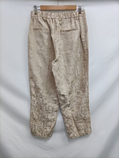 SCALPERS. Pantalón beige fluido T.m