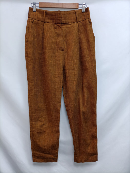 UTERQÜE. Pantalón fluido teja T.m