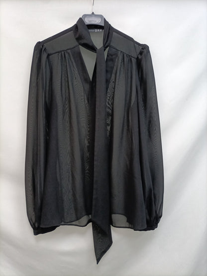 PRIMARK.Blusa negra transparente T.40