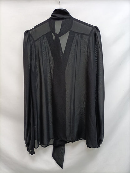 PRIMARK.Blusa negra transparente T.40