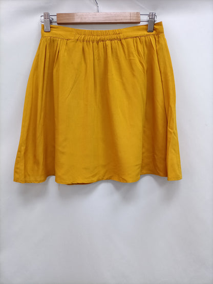 FOREVER21. Falda amarilla botones T.s