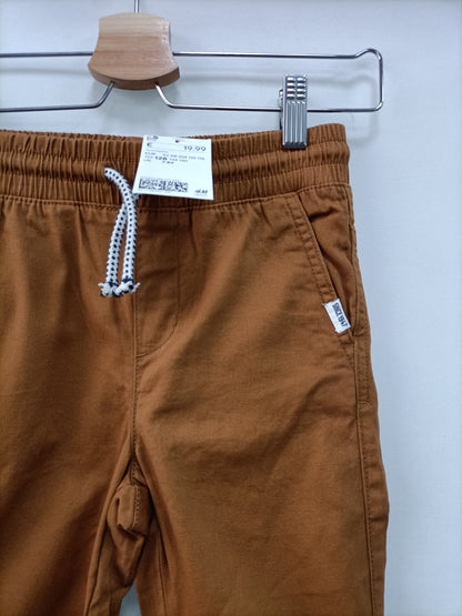 H&M. Pantalón mostaza T.7/8