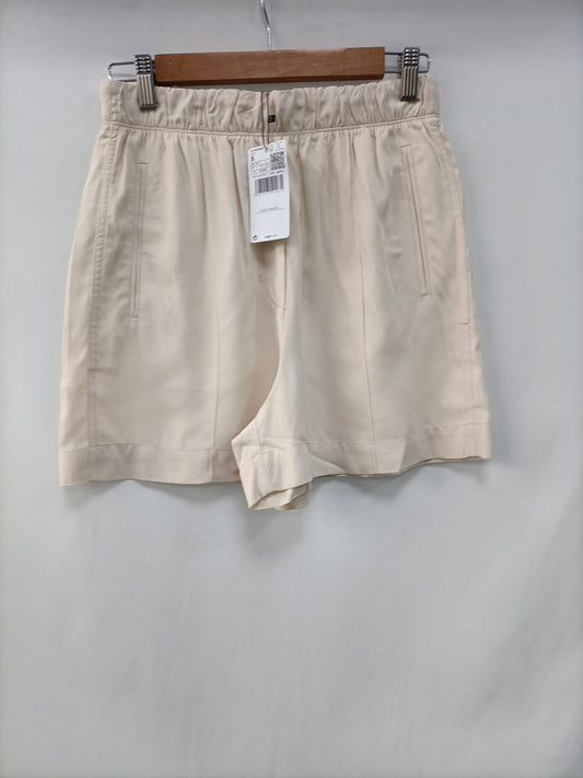 MANGO. Shorts beige fluido T.s