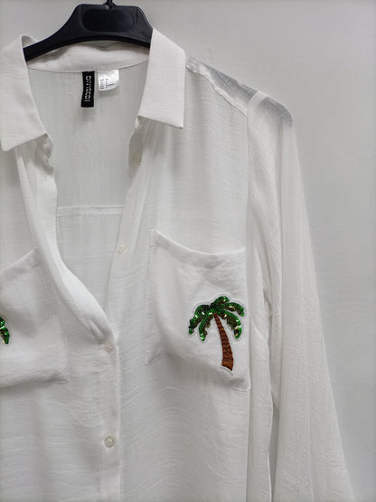 H&M. Blusa blanca oversized T.36