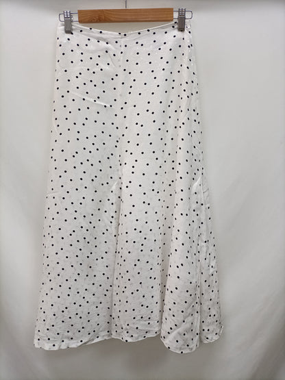 H&M. Falda midi lunares T.34
