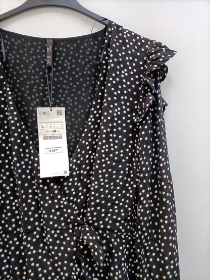 ZARA. Mono negro lunares T.l