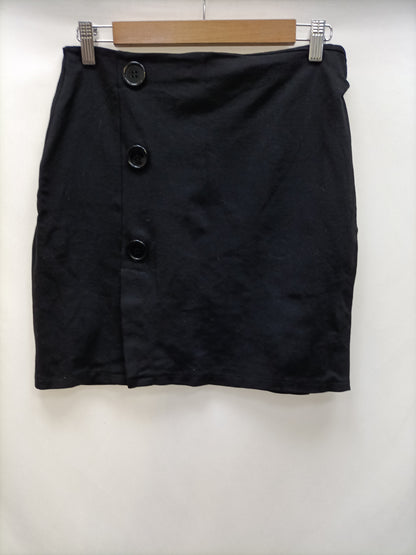 OTRAS. Falda negra botones T.m