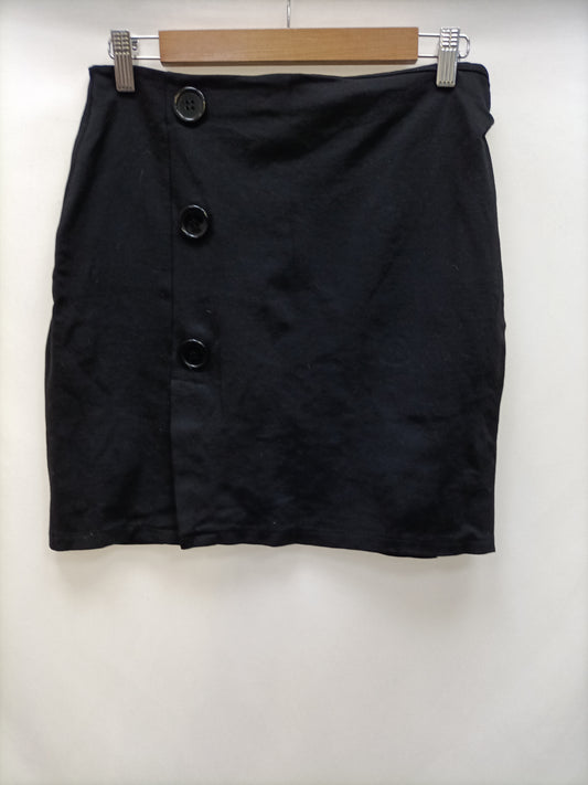 OTRAS. Falda negra botones T.m