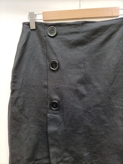 OTRAS. Falda negra botones T.m