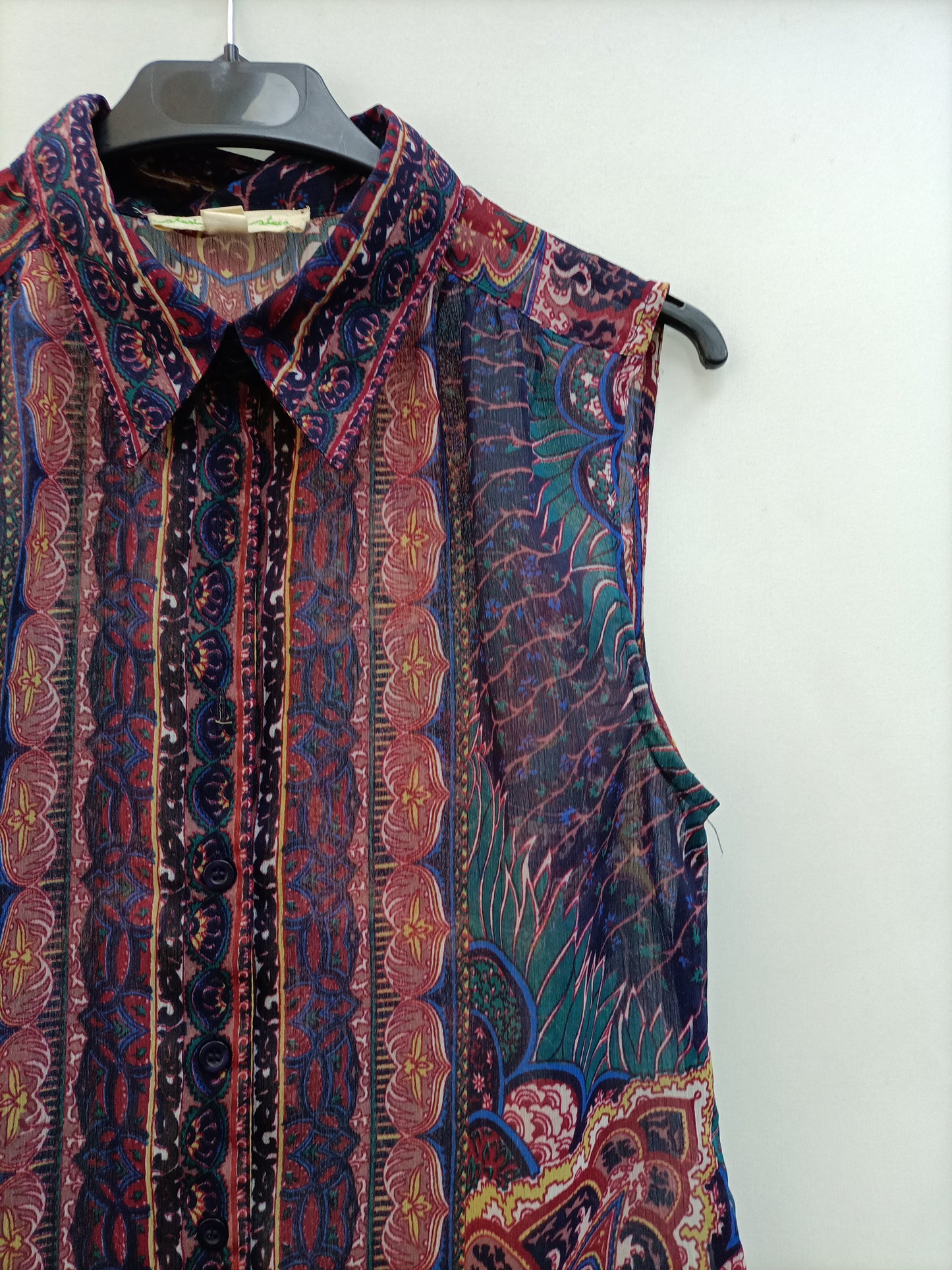 URBAN OUTFITTERS. TS semi-sheer sleeveless blouse