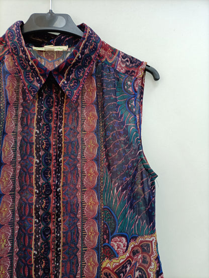 URBAN OUTFITTERS. TS semi-sheer sleeveless blouse