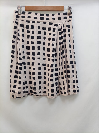 LA FÉE MARABOUTÉE. Tm beige checkered skirt