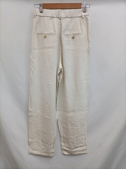 H&M. Pantalón beige fluido T.38