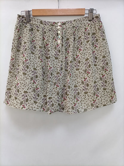 NICOLI. Falda verde flores T.18(38)