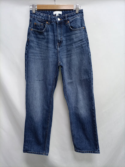 H&M. Pantalón denim ancho oscuro T.34