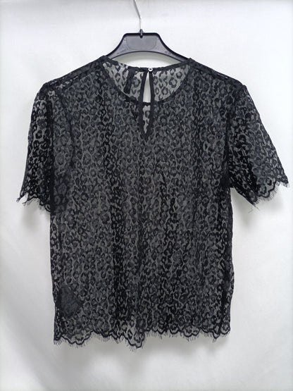 H&M. top encaje negro T.34