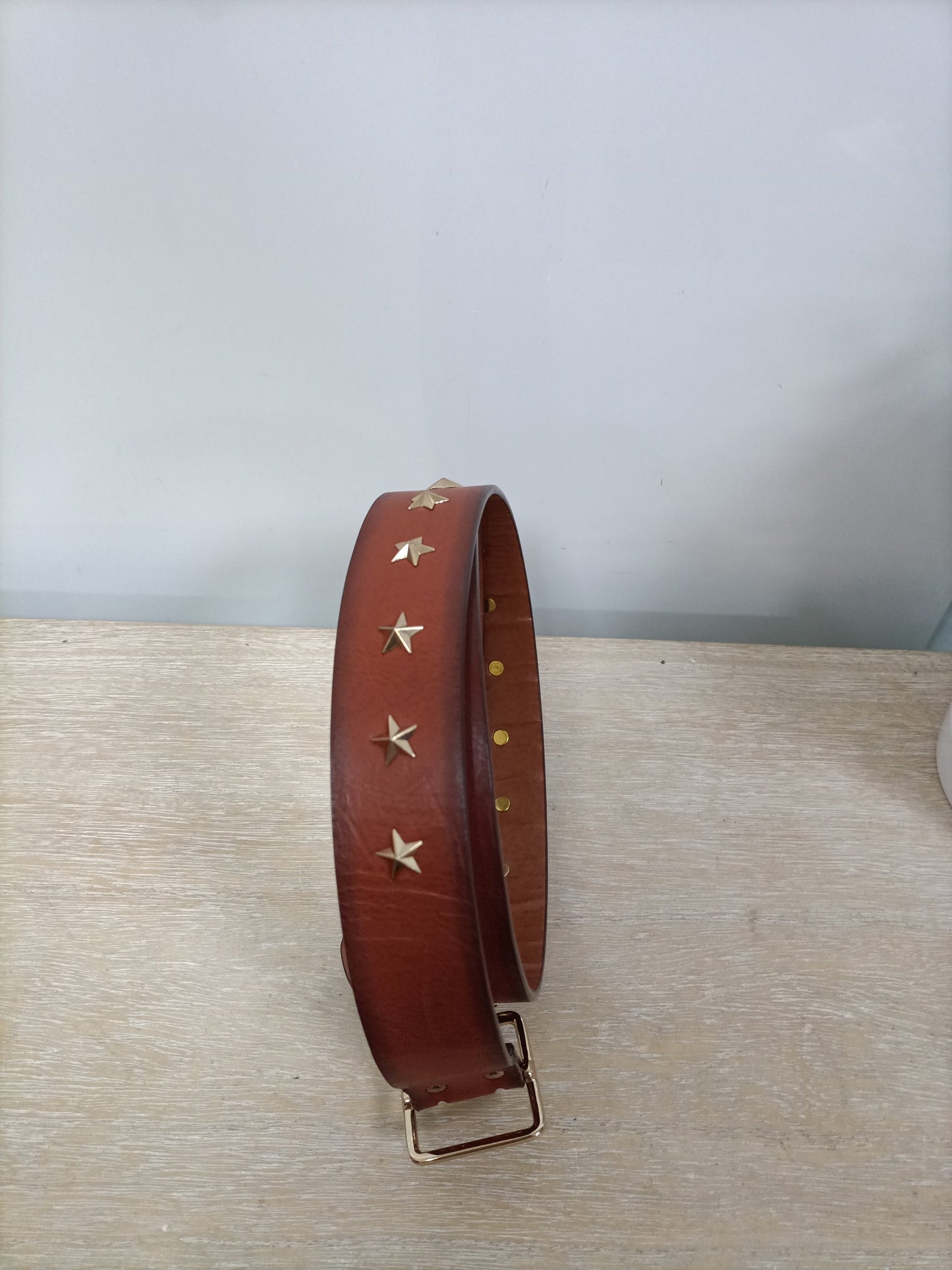 ZARA. Cinturón camel estrellas T.90