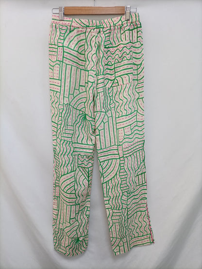 ZARA. Pantalón beige estampado T.s