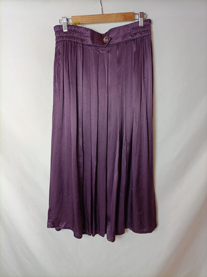 OTRAS. Falda midi burdeos T.42