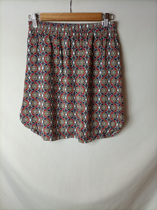 OTRAS. Falda corta estampada. T L (S/M)
