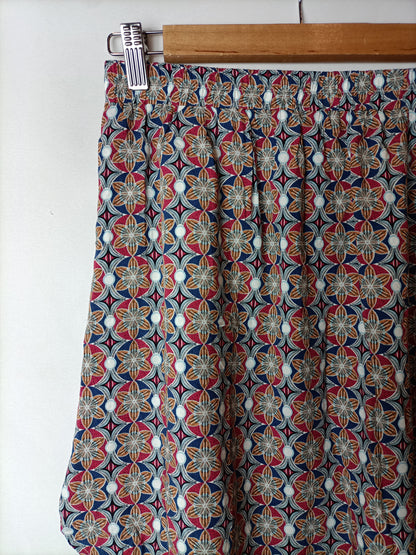 OTRAS. Falda corta estampada. T L (S/M)