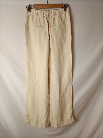 ZARA. Pantalón palazzo beige. T S (Tara)