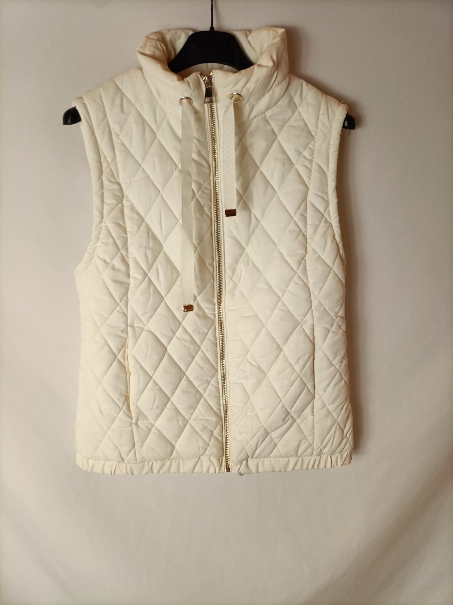 SFERA. Chaleco acolchado beige. T S