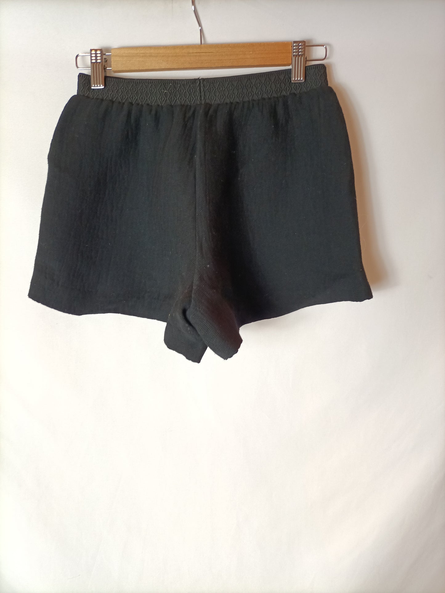 MAJE. Black elastic shorts T.34