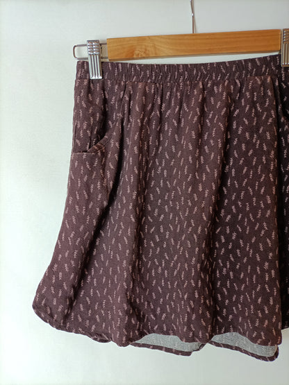 DOUBLE AGENTE. Falda burdeos flechas T.xs