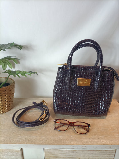 BIMBA Y LOLA. Bolso piel color berenjena oscuro