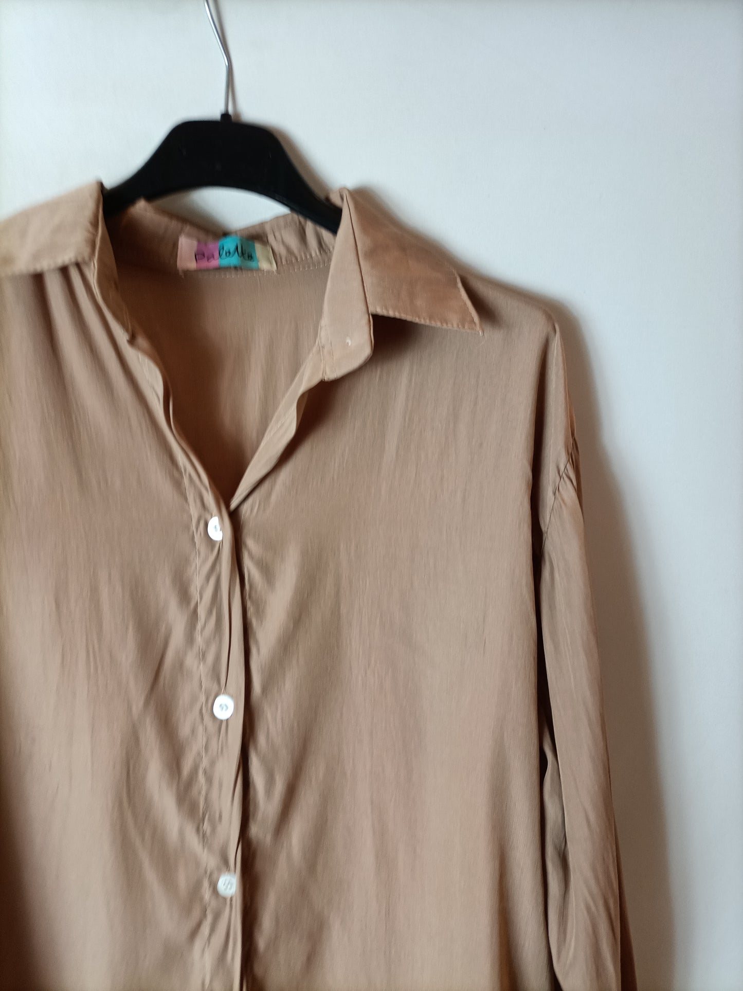 OTHERS. Light brown flowing blouse. TS