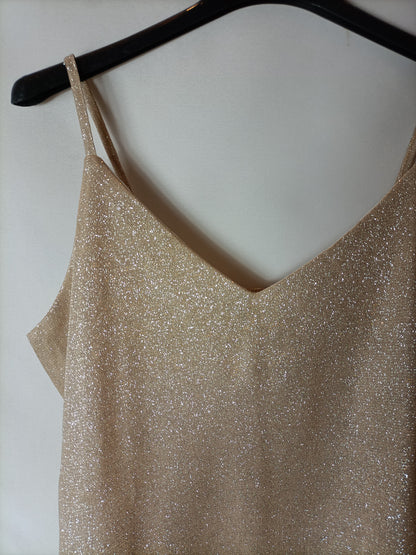 OTRAS. Top efecto dorado. T S