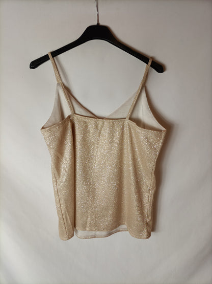 OTRAS. Top efecto dorado. T S