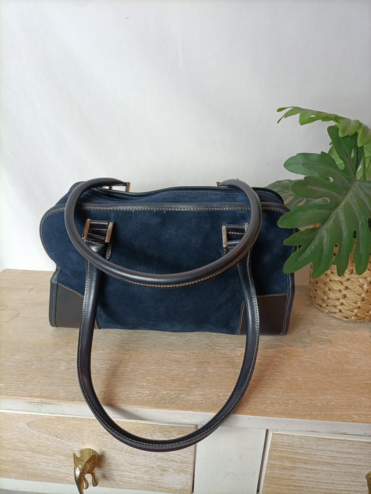 OTRAS. Bolso azul antelina.