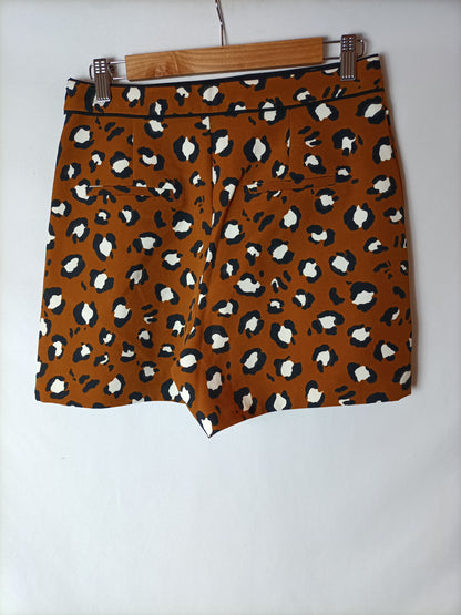 ZARA. Shorts mostaza print T.m