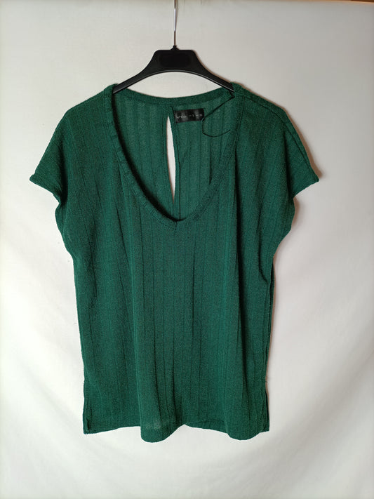 LEFTIES. Green ribbed top. T.S.