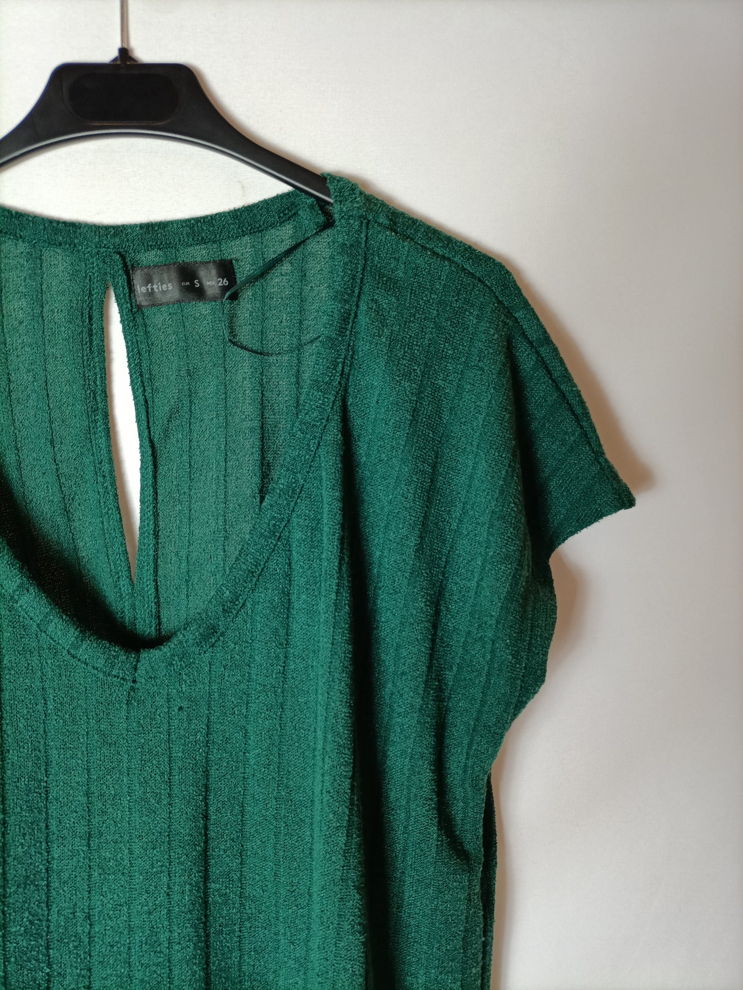 LEFTIES. Green ribbed top. T.S.